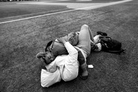 Getting out of the homeless shelter for some air, Kathie & Terrill enjoy a nap on a baseball field.